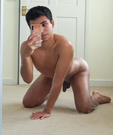 Nude boy taking a selfie