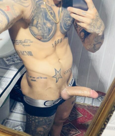 Tattooed boy with a big cock