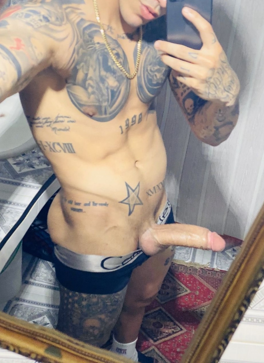 Tattooed boy with a big cock
